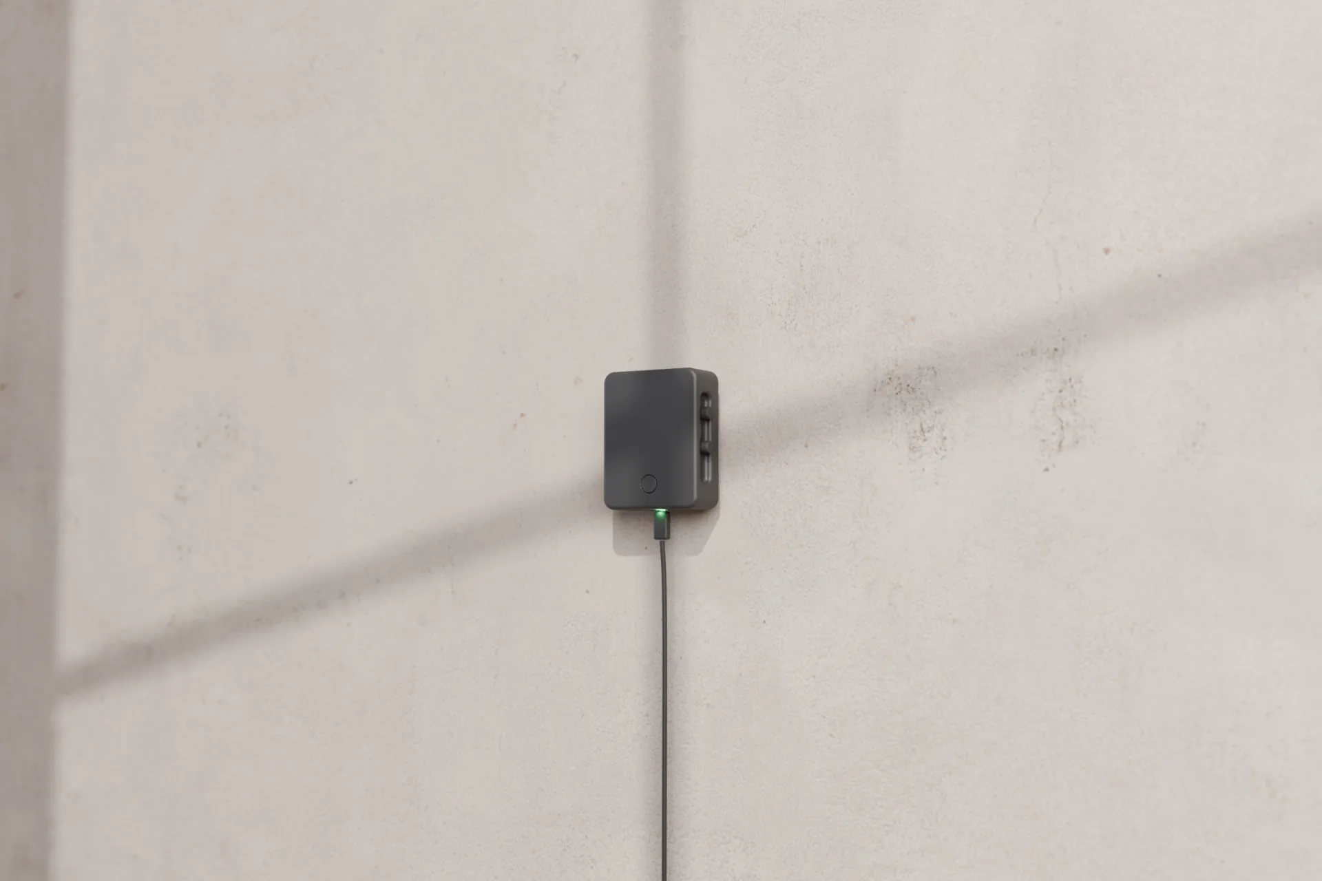 Canaro Hub Pro mounted on a wall with its status light on